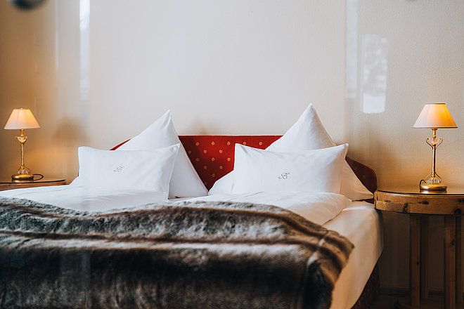 Double bed in a Category C3 hotel suite at the 4*S Hotel Bergwelt