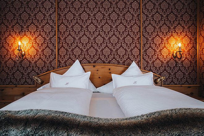 Bedroom in the Landhaus Suite at the Bergwelt Ski and Wellness Hotel in Obergurgl 